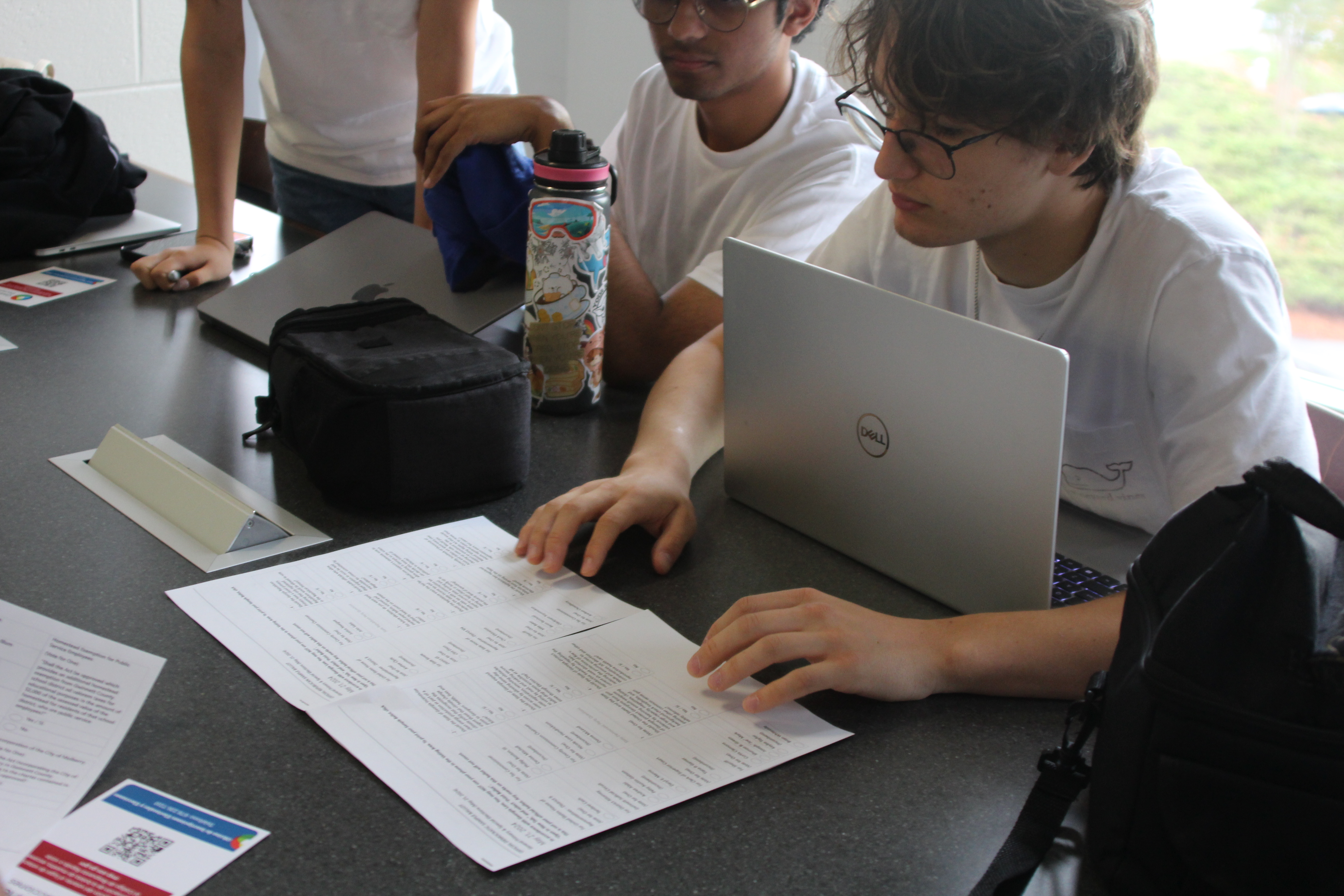 Students learn about becoming a poll worker and the voting process in Georgia.